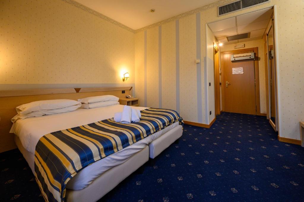 Postel nebo postele na pokoji v ubytování Hotel Torre Di Pratolungo