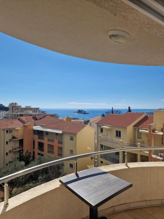 a balcony with a table and a view of the ocean at Marta apartment in Petrovac na Moru