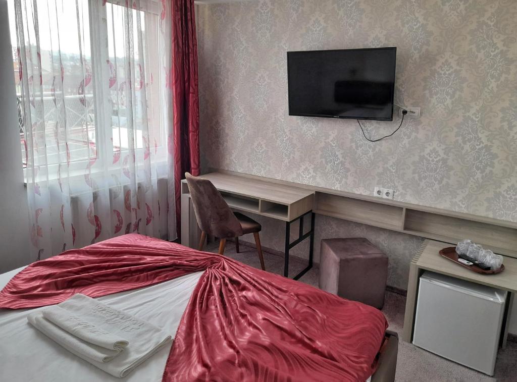 Postel nebo postele na pokoji v ubytování Hotel Alexis