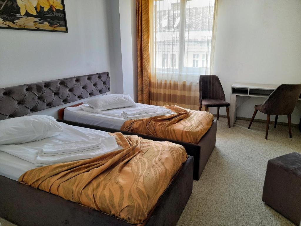Postel nebo postele na pokoji v ubytování Hotel Alexis