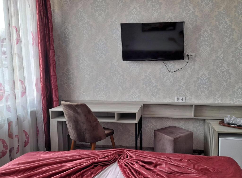 TV a/nebo společenská místnost v ubytování Hotel Alexis