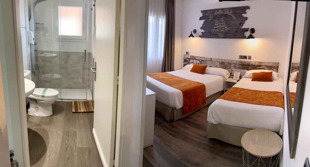 Posteľ alebo postele v izbe v ubytovaní Hotel Bella Dolores