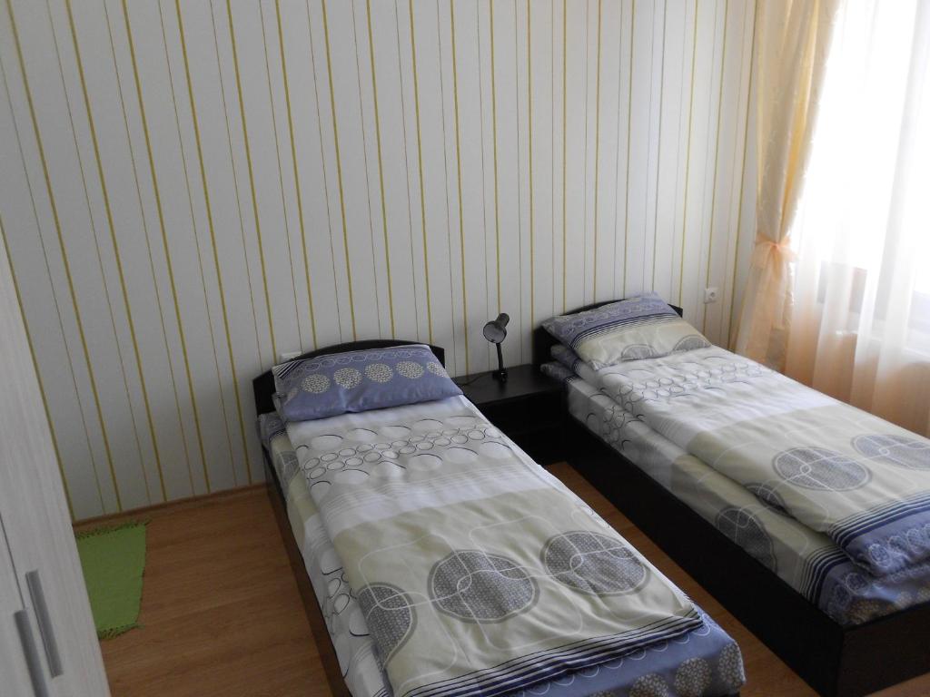 Postel nebo postele na pokoji v ubytování Guest House Tsenovi