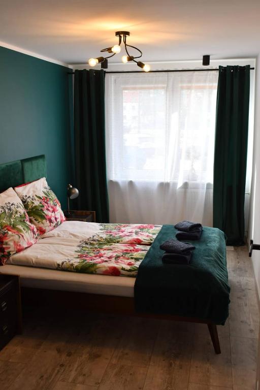 Posteľ alebo postele v izbe v ubytovaní Loft Apartament ULA