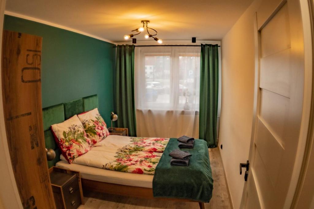 Posteľ alebo postele v izbe v ubytovaní Loft Apartament ULA