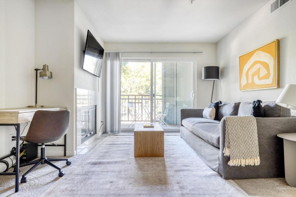 a living room with a couch and a table at Sunnyvale 1BR w Pool WD Gym nr Google SFO-733 in Sunnyvale