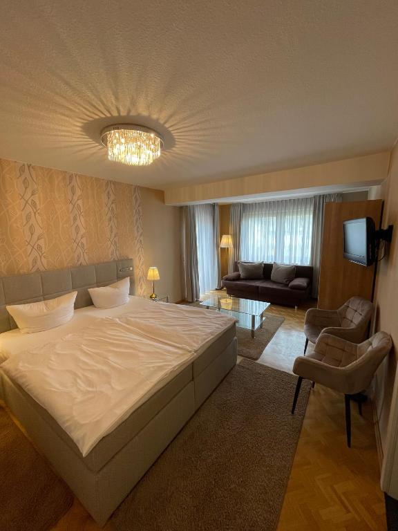 Postel nebo postele na pokoji v ubytování Hotel Zum Fährturm
