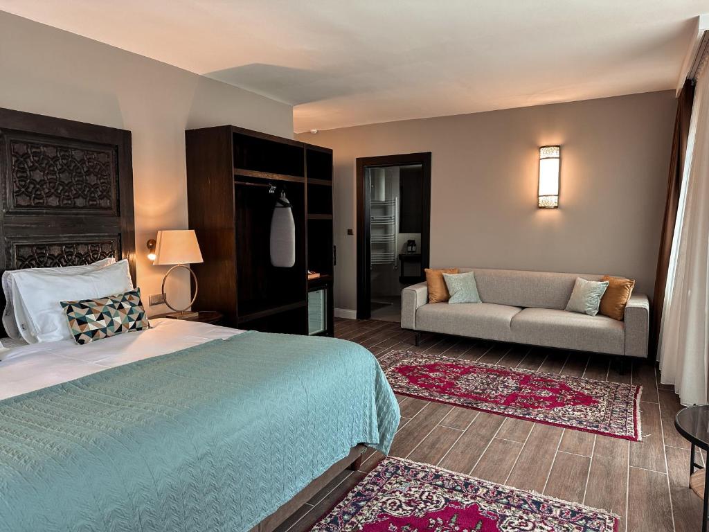 Postel nebo postele na pokoji v ubytování Osmanli Cappadocia Hotel
