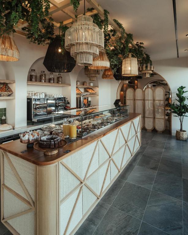 a kitchen with a counter with food on it at AlmaLusa Comporta in Comporta
