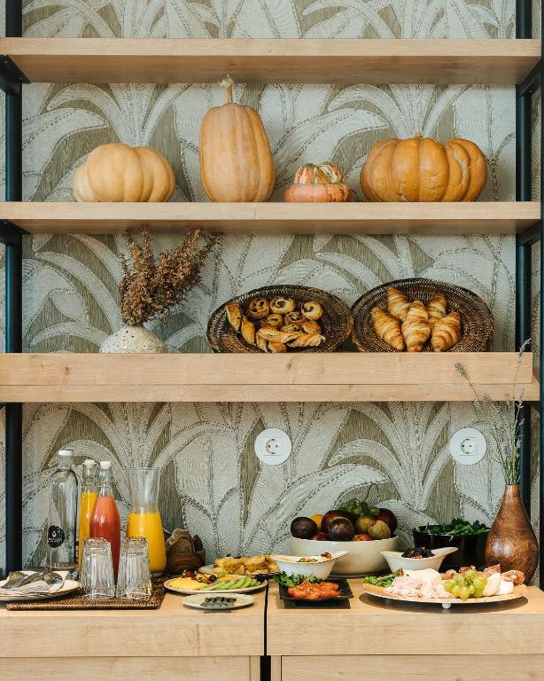 a shelf filled with lots of different types of food at AlmaLusa Comporta in Comporta