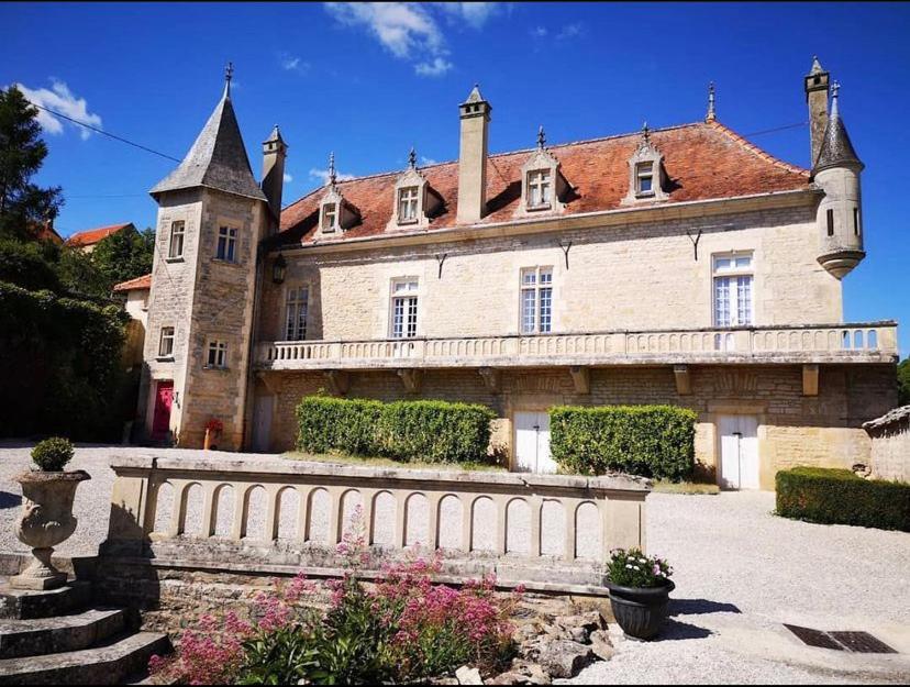 a large building with a fence in front of it at LE PRIEURE DE BUFFON in Buffon