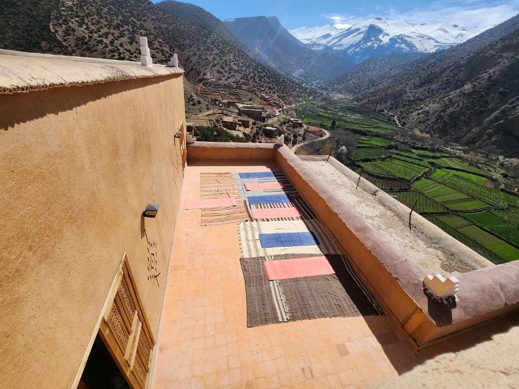 a balcony of a building with a view of a mountain at AdaZen Ecolodge in Azilal
