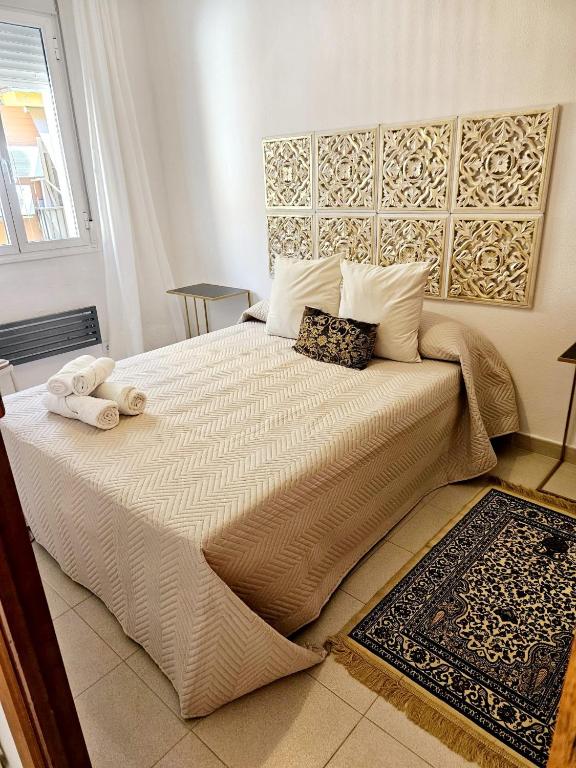 Łóżko lub łóżka w pokoju w obiekcie Apartamento Exclusivo en Sevilla