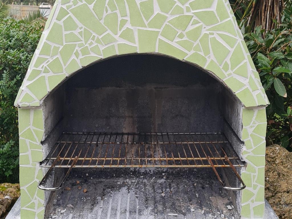 Barbecuefaciliteiten beschikbaar voor gasten van het appartement
