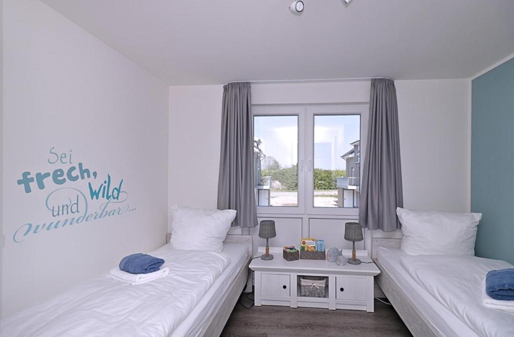 Postel nebo postele na pokoji v ubytování Haus Nr 34, Ferienhaus Fischerhus