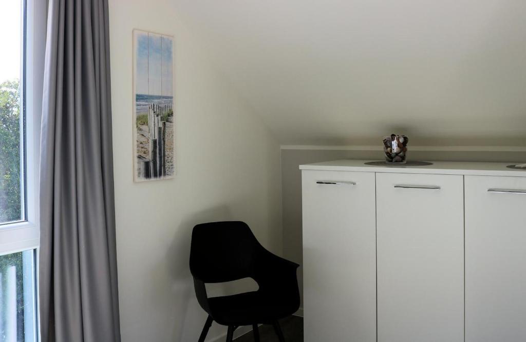 Fotografie z fotogalerie ubytování Haus Nr 34, Ferienhaus Fischerhus v destinaci Wangerland