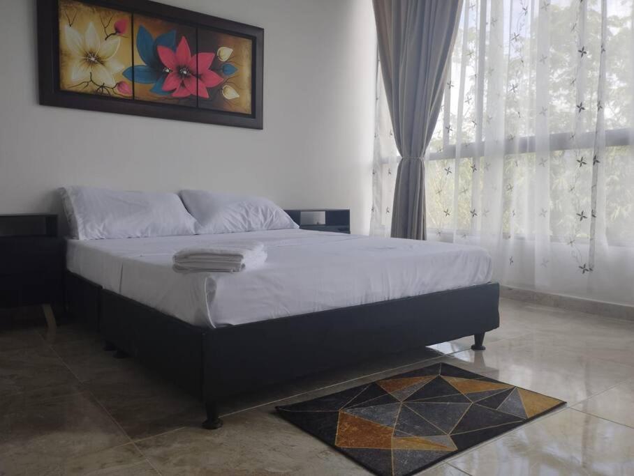 Un pat sau paturi într-o cameră la Apartamento el mirador