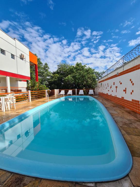 a large swimming pool on top of a building at Pousada Vista do Rio in Barreirinhas