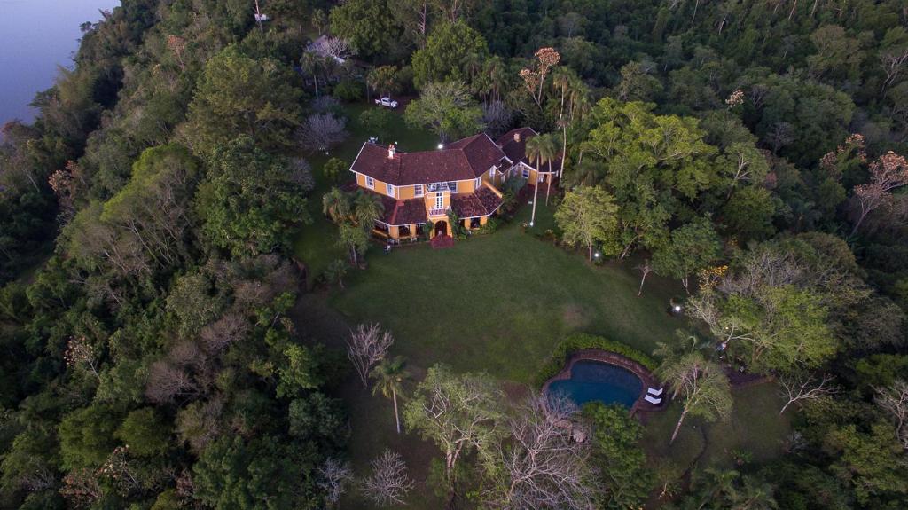 an aerial view of a large house on a hill at Pristine Residence Iguazú in Puerto Libertad