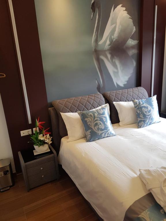Postel nebo postele na pokoji v ubytování hotel whiteswan