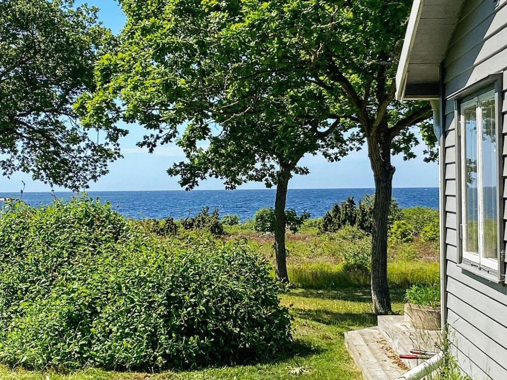 a house with a view of the ocean at 6 person holiday home in STURKÖ-By Traum in Sturkö