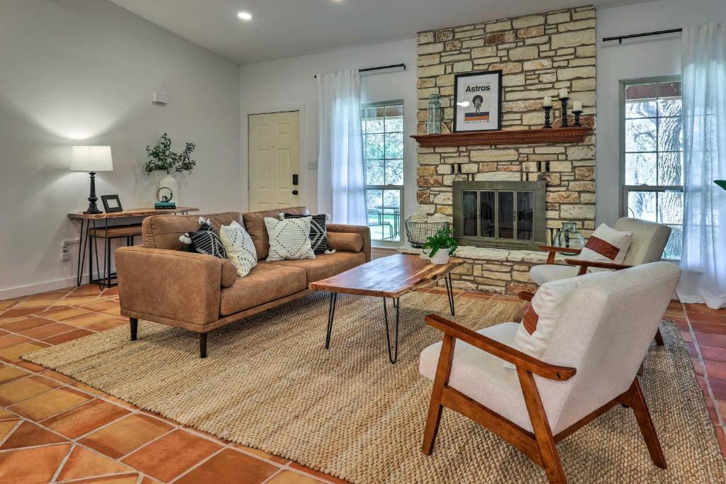 a living room with a couch and a fireplace at San Marcos Vacation Rental 4 Miles to Downtown! in San Marcos