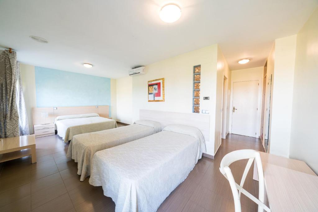 Postel nebo postele na pokoji v ubytování Hotel La Colina