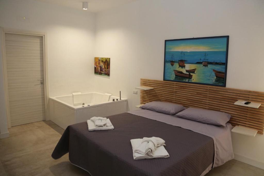 Postel nebo postele na pokoji v ubytování B&B La Dimora di Nonno Lucio