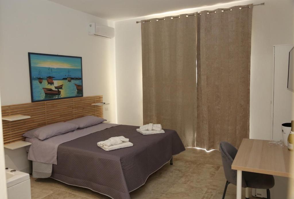 Postel nebo postele na pokoji v ubytování B&B La Dimora di Nonno Lucio