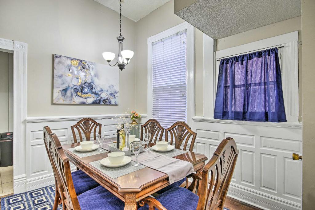 a dining room with a table and chairs at Bright Augusta Vacation Rental, 2 Mi to Riverwalk! in Augusta