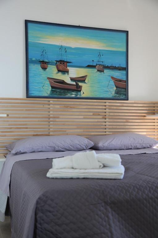 Postel nebo postele na pokoji v ubytování B&B La Dimora di Nonno Lucio