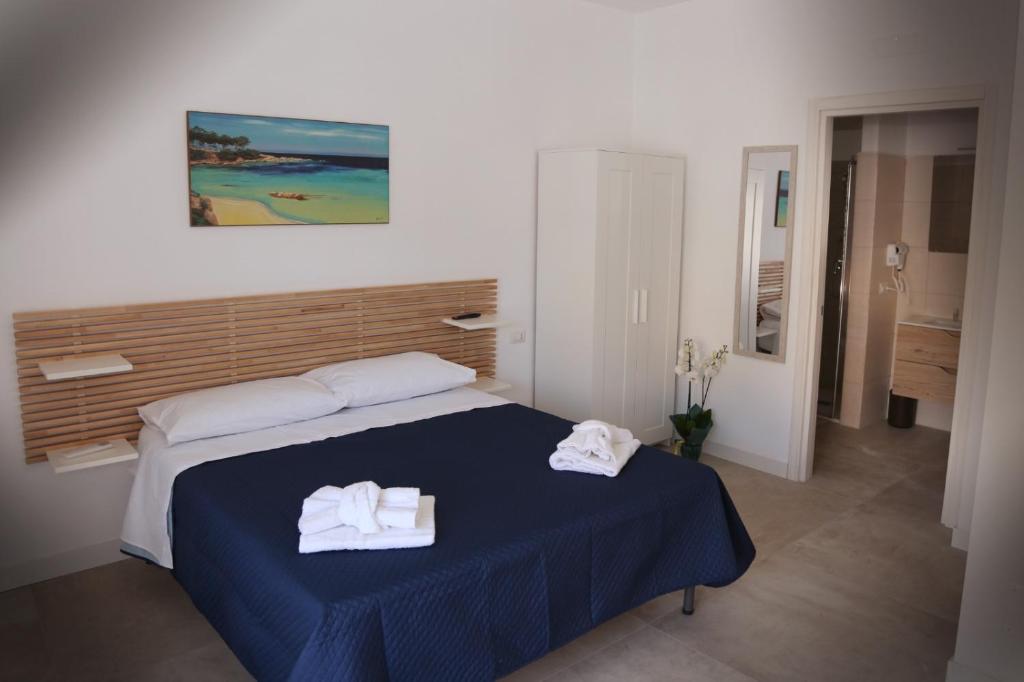 Postel nebo postele na pokoji v ubytování B&B La Dimora di Nonno Lucio