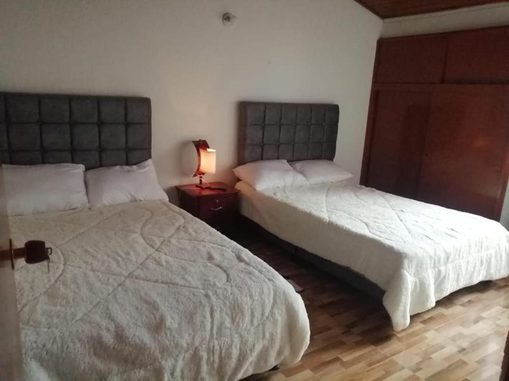 Postel nebo postele na pokoji v ubytování Claudiae