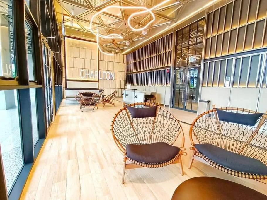 a lobby with chairs and tables in a building at Millerz Square全新房源@Old Klang Road 1909 in Kuala Lumpur