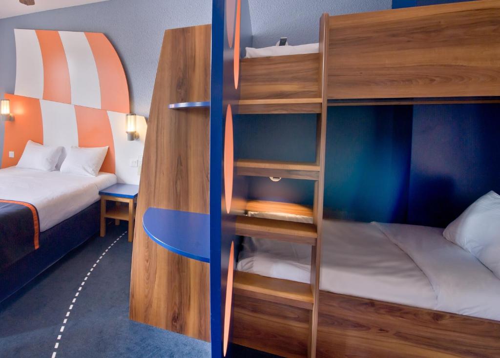 Letto o letti in una camera di Explorers Hotel Marne-la-Vallée