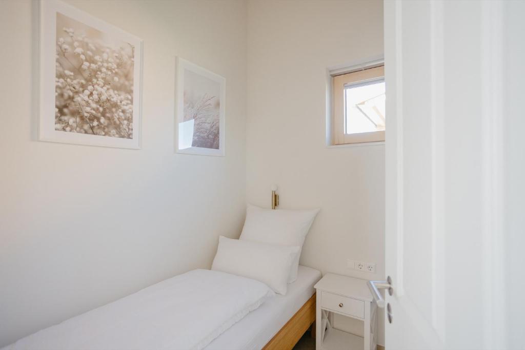 Postel nebo postele na pokoji v ubytování Weinberg Chalets