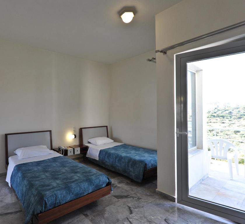 Postel nebo postele na pokoji v ubytování Rodon Hotel