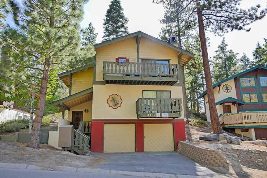 a house with a balcony on the side of it at 3407 Pine Hill Home in South Lake Tahoe