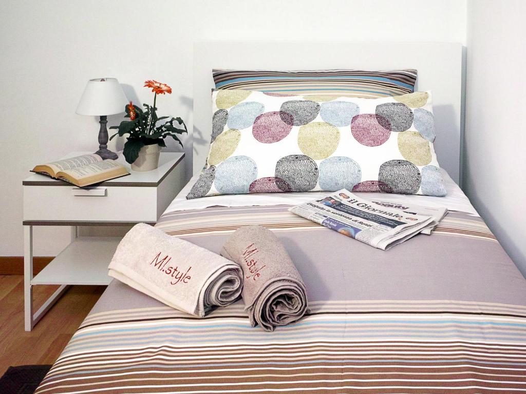Una cama o camas en una habitación de MI. Style