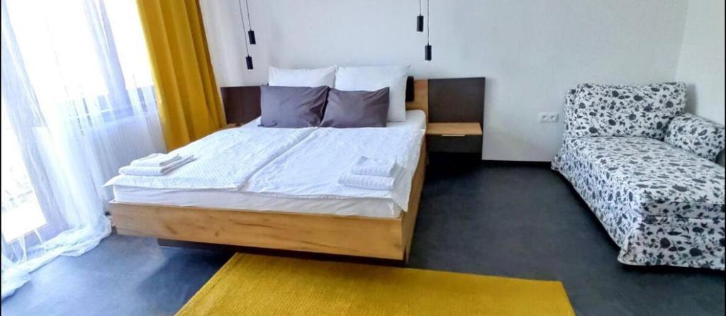 A bed or beds in a room at Penzion Ivka