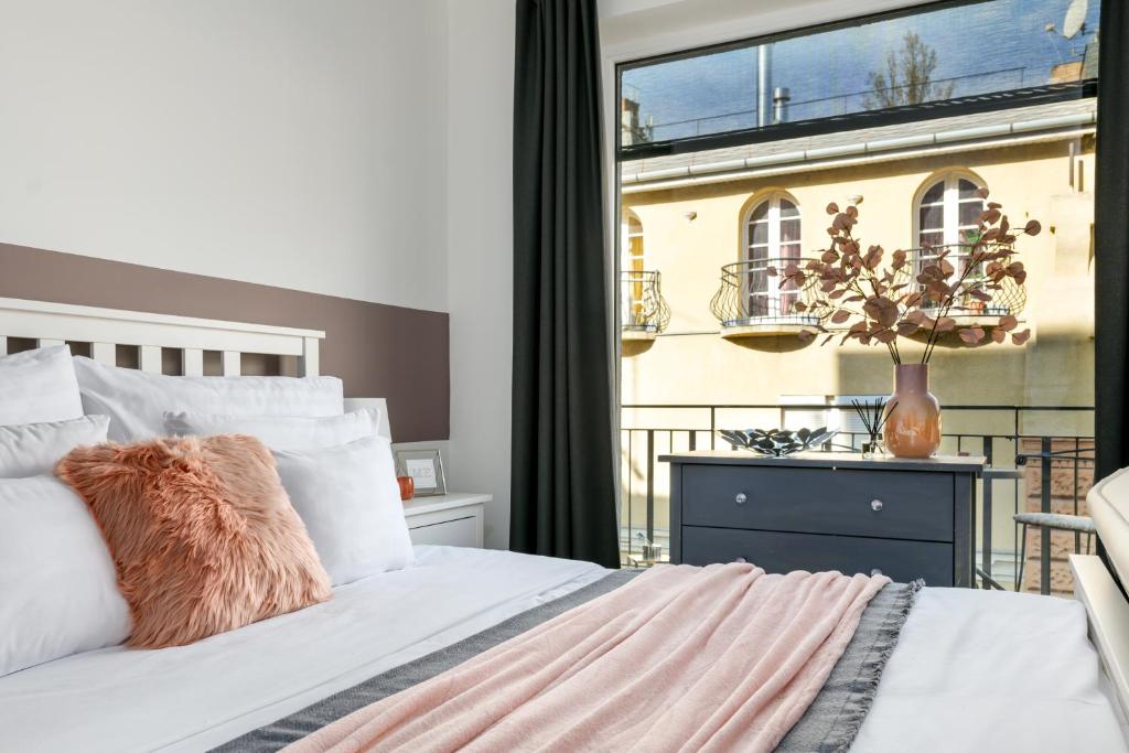 Postel nebo postele na pokoji v ubytování Leonardo50 Apartment
