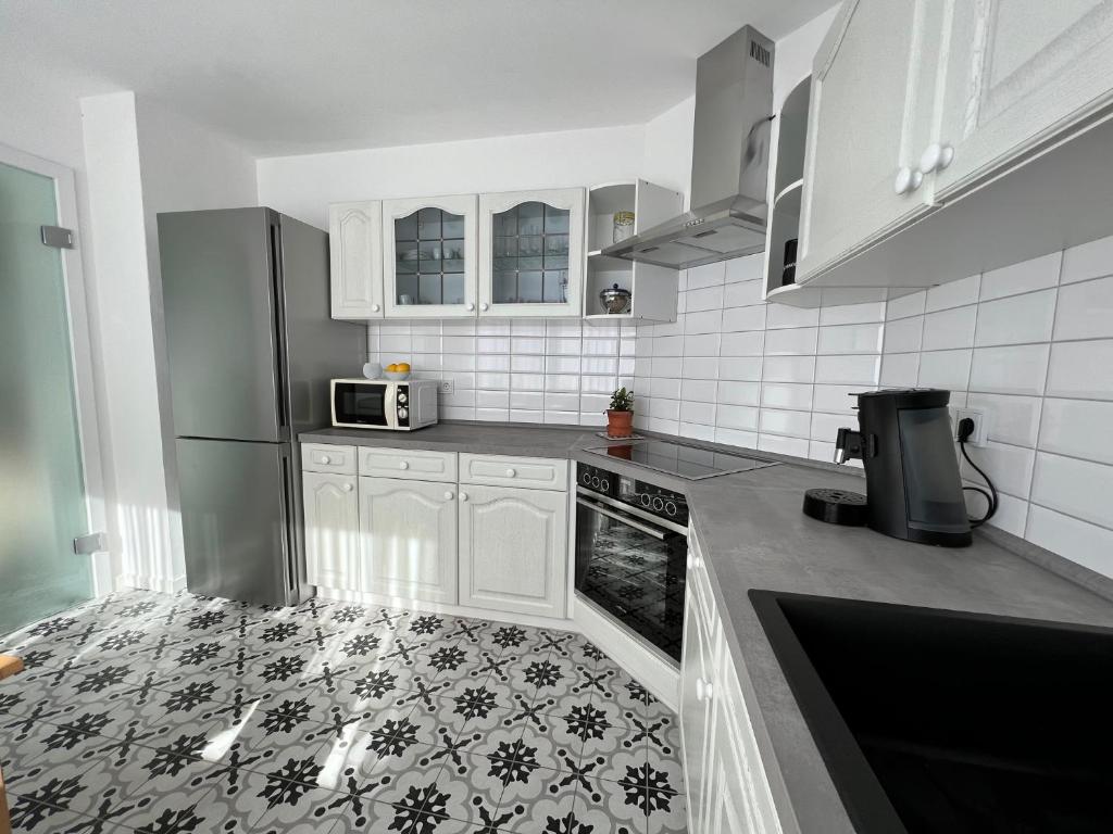 Kuchyň nebo kuchyňský kout v ubytování Ferienhaus EifelOne