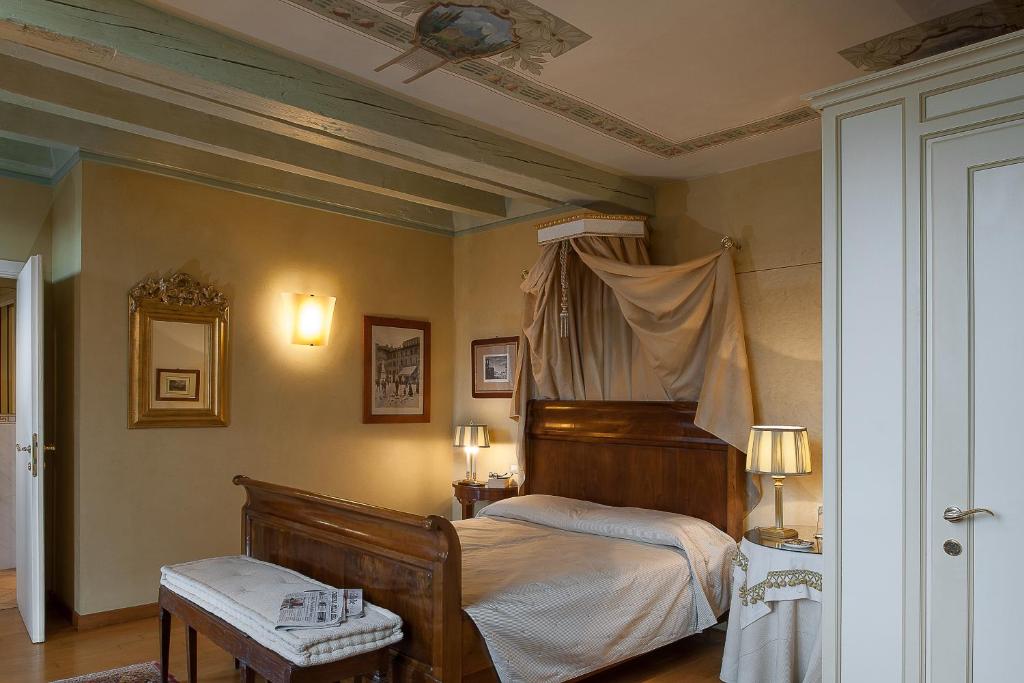 Postel nebo postele na pokoji v ubytování Domus Nova Palace - Italian Homing