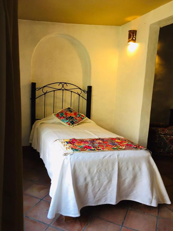 Postel nebo postele na pokoji v ubytování Posada Los Colorines
