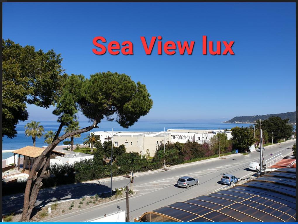 a view of a road with cars driving down a street at BLUE EYES APARTMENTS in Ixia