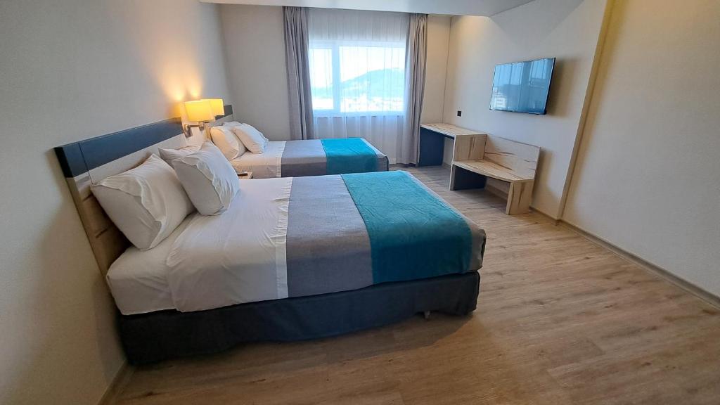Una cama o camas en una habitación de Hotel Diego de Almagro Temuco Express