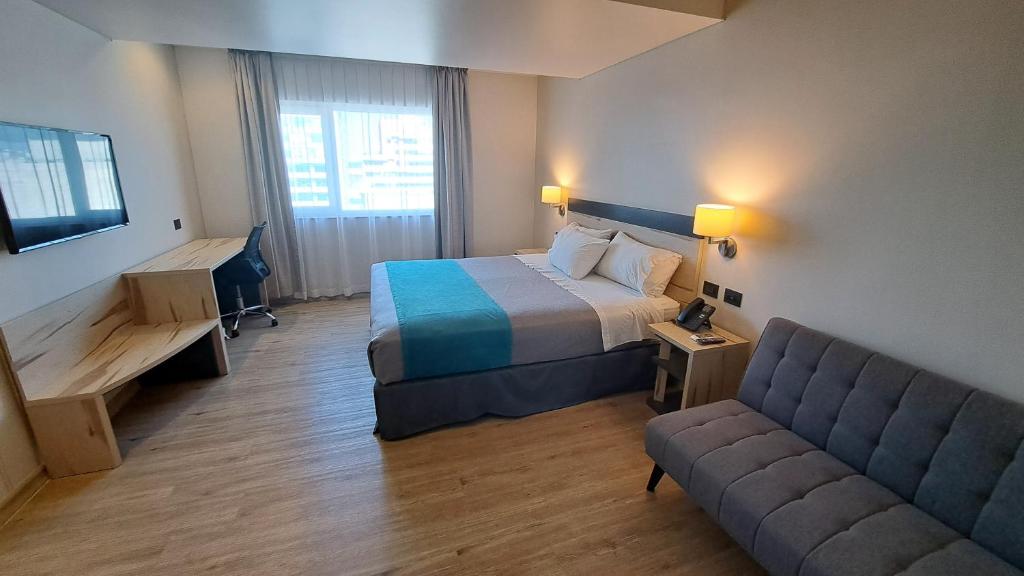 Una cama o camas en una habitación de Hotel Diego de Almagro Temuco Express