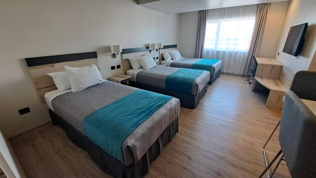 Una cama o camas en una habitación de Hotel Diego de Almagro Temuco Express
