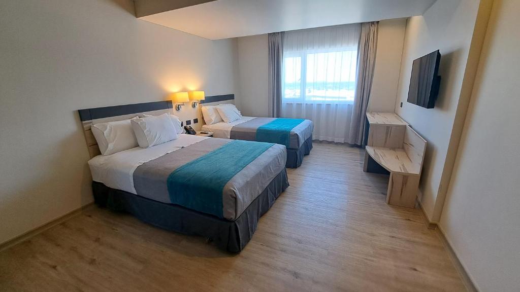 Una cama o camas en una habitación de Hotel Diego de Almagro Temuco Express