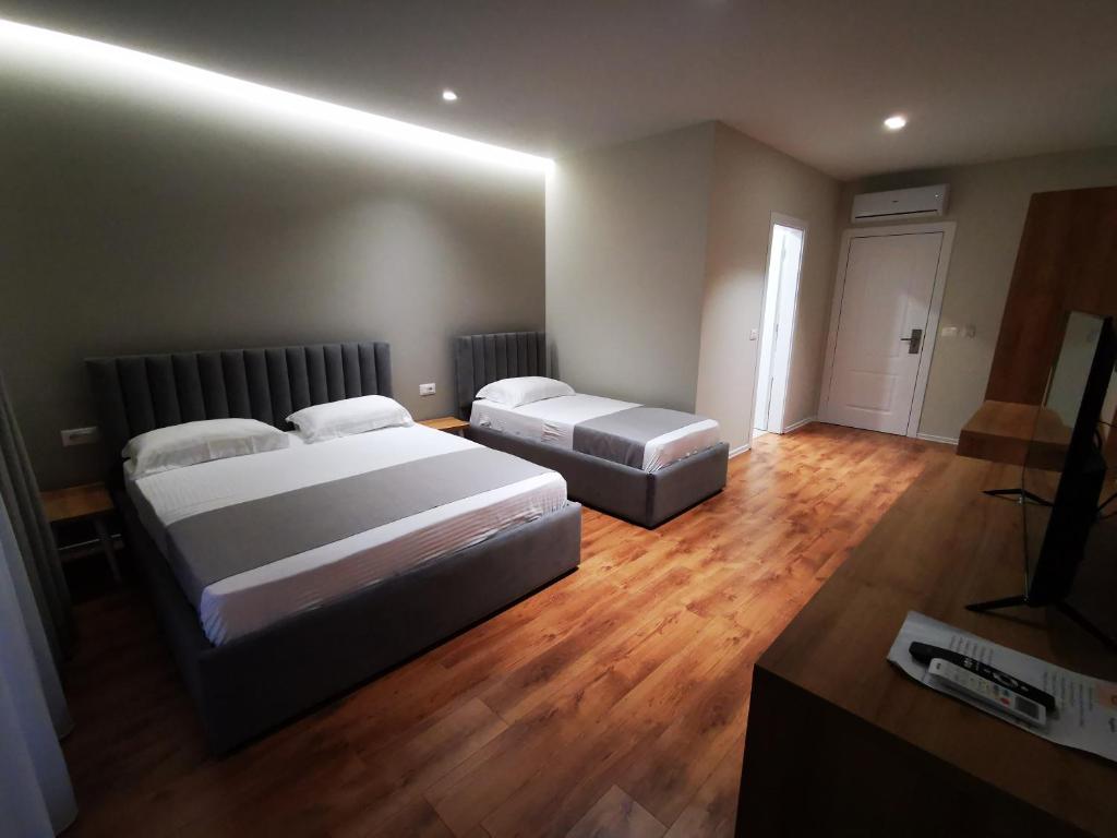 Postel nebo postele na pokoji v ubytování Te Aldo Hotel